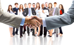 Hand shaking in front of a group of people
